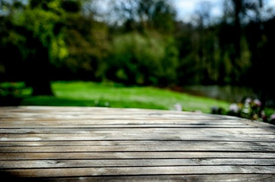 http://www.dreamstime.com/royalty-free-stock-photos-empty-wooden-table-spring-garden-green-image32554558